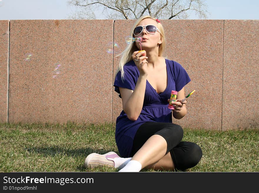 Girl blowing soap bubbles