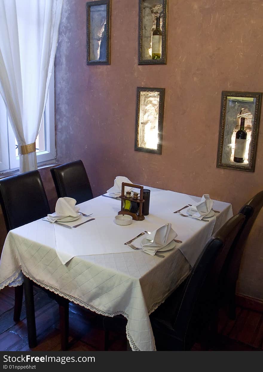 Table with cutlery, plaits and glasses in Restaurant. Table with cutlery, plaits and glasses in Restaurant