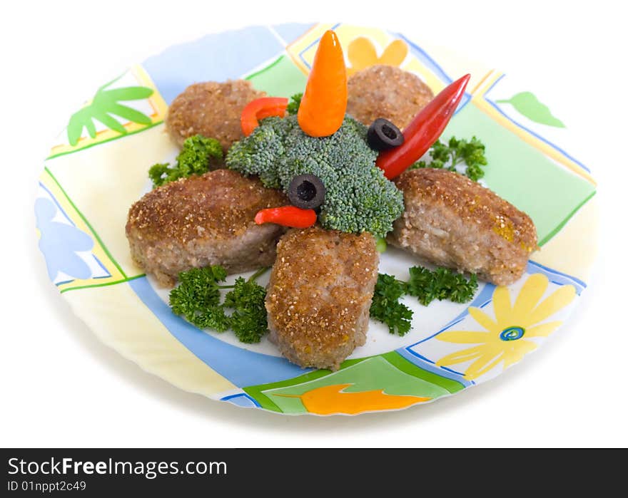 Meat rissoles on plate with broccoli and chilly