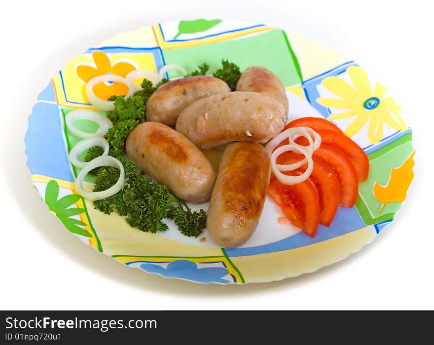 Meat cutlets with tomato on a round plate. Meat cutlets with tomato on a round plate