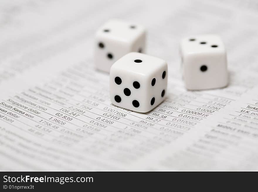 Dice on a stock newspaper. Dice on a stock newspaper