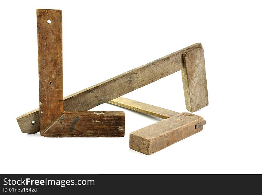 Three old wooden carpenter squares isolated on a white background. Three old wooden carpenter squares isolated on a white background