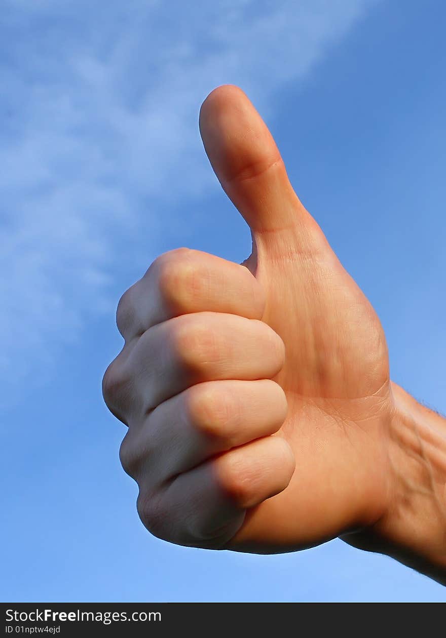 Hand on blue sky background. Hand on blue sky background