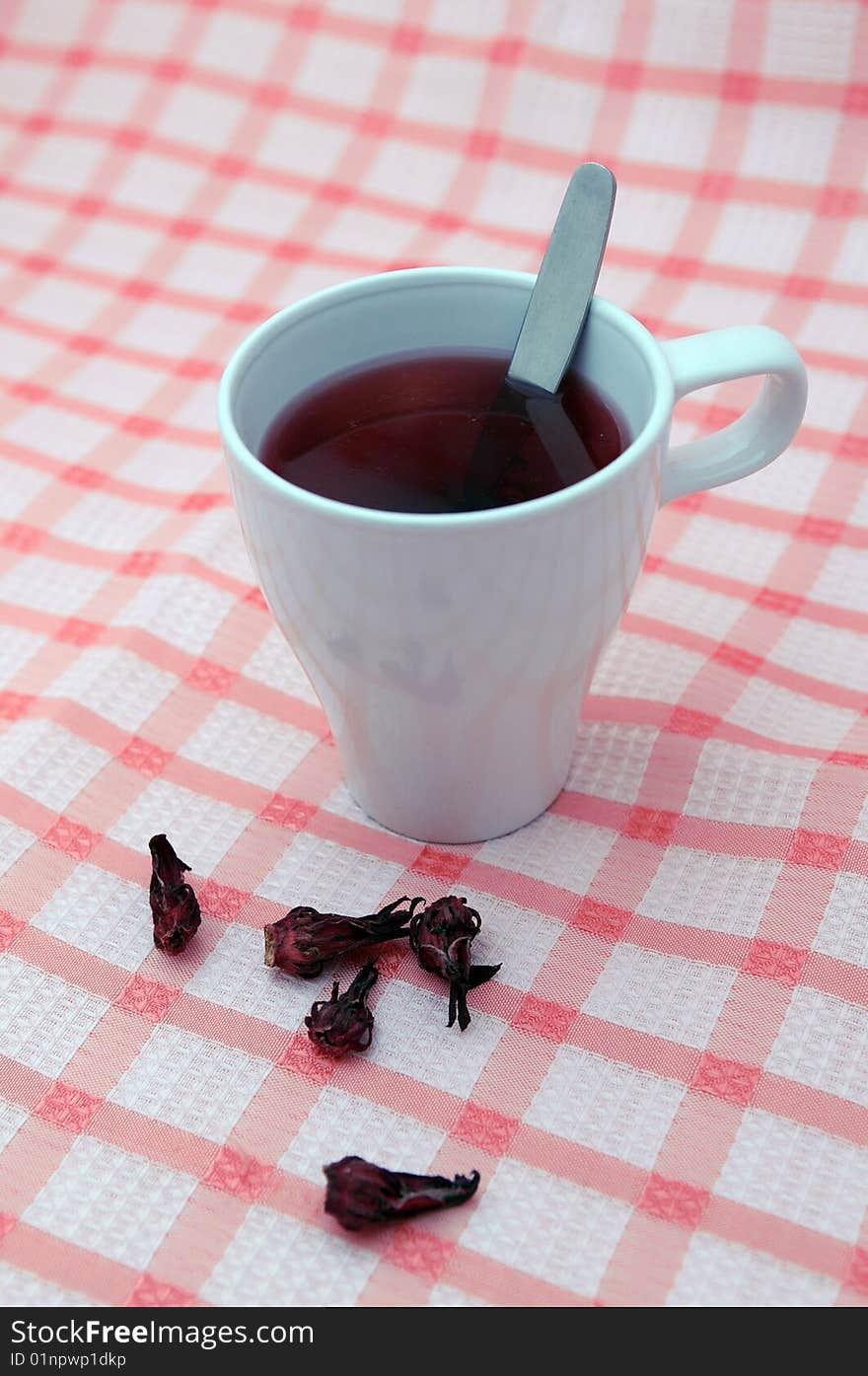 White cup with tea.