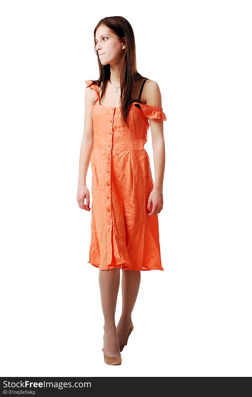 Brunette girl in the orange dress isolated on a white background