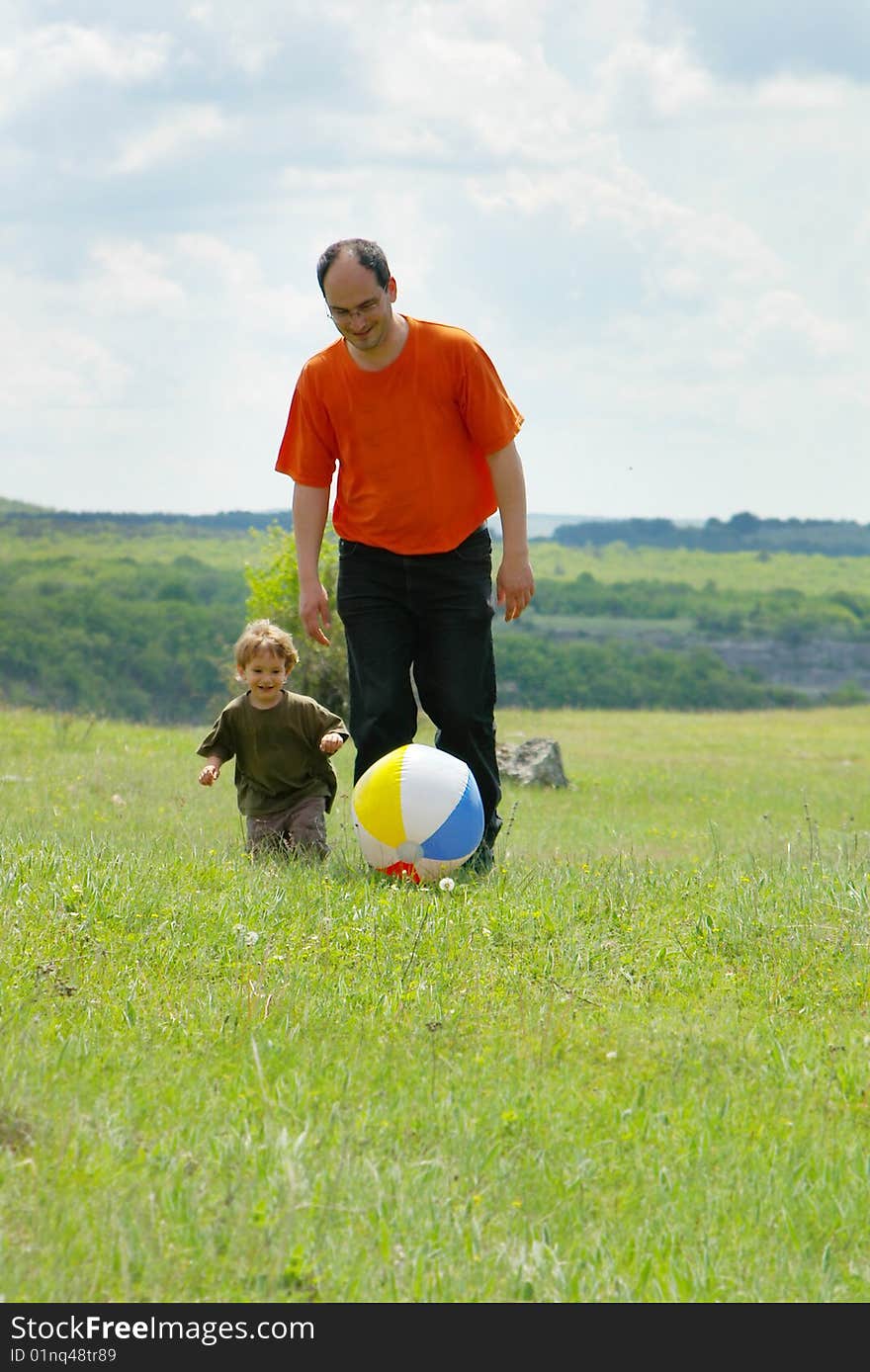 Father And Son Playing With Ball