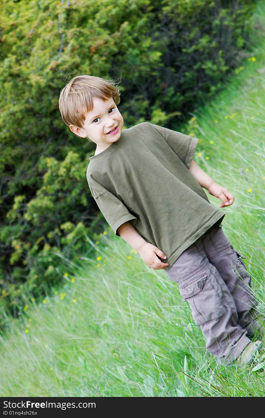 Cute boy on natural background