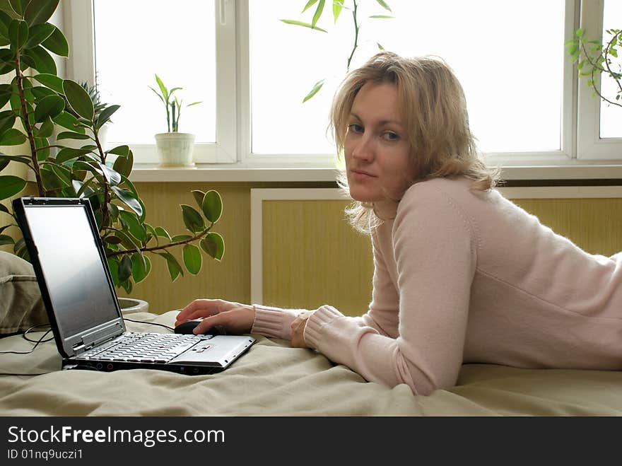 Woman using laptop at home. Woman using laptop at home