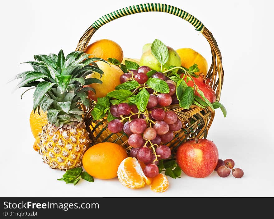 Background with red grape,
apple, orange,pineapple in basket. Background with red grape,
apple, orange,pineapple in basket