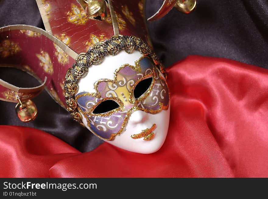 Venetian mask on a red background