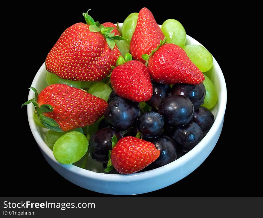 Some fruits isolated on a black background. Some fruits isolated on a black background.