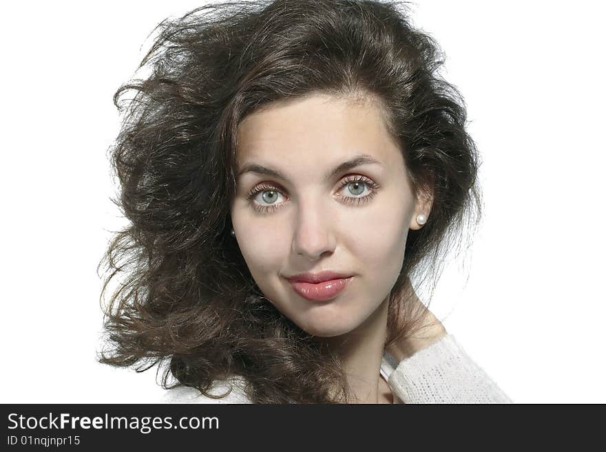 Portrait of the smiling dark-haired girl on a white background