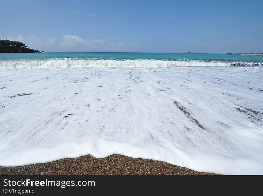 Beach with waves crashing into the shore