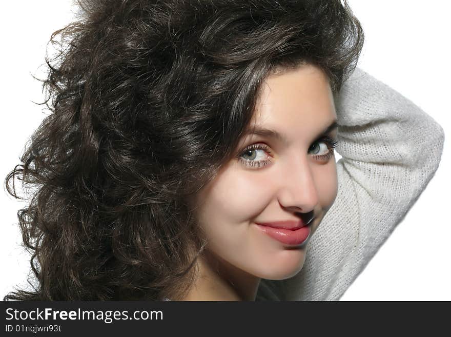 Portrait of the smiling dark-haired girl on a white background