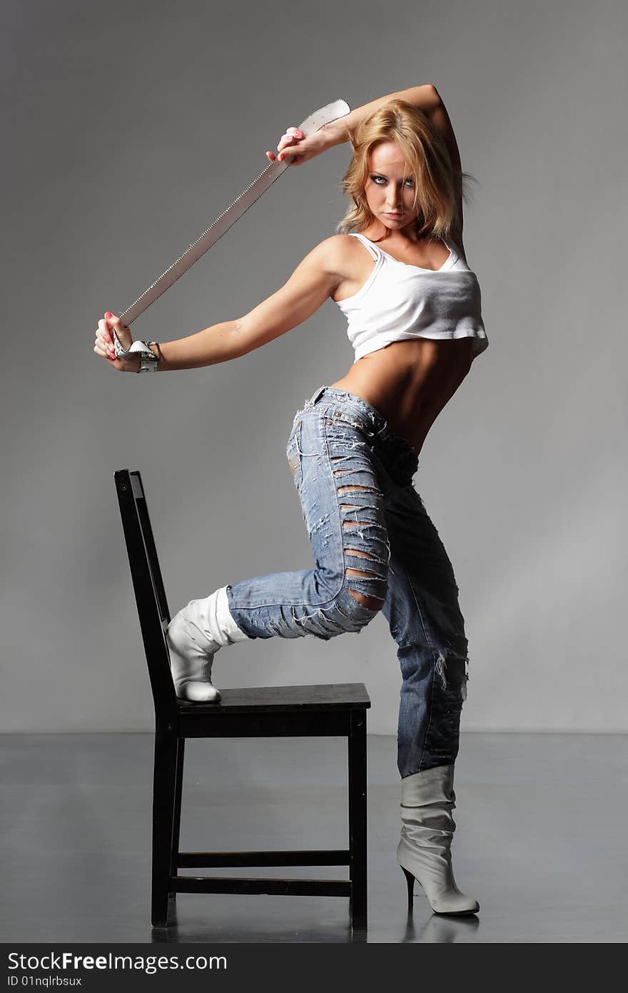 Modern style dancer posing on studio background. Modern style dancer posing on studio background