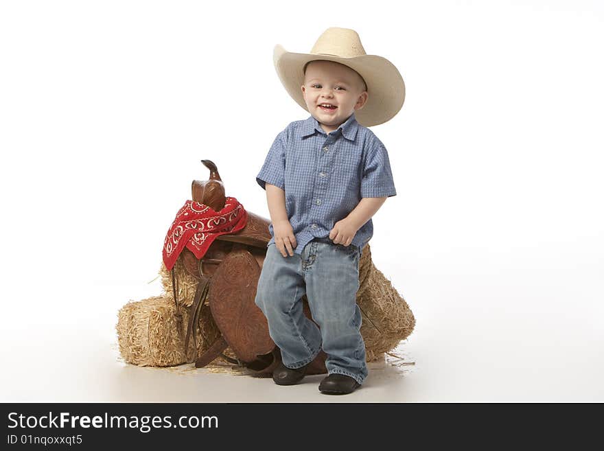 Little boy on white with cowboy hat on white background. Little boy on white with cowboy hat on white background.