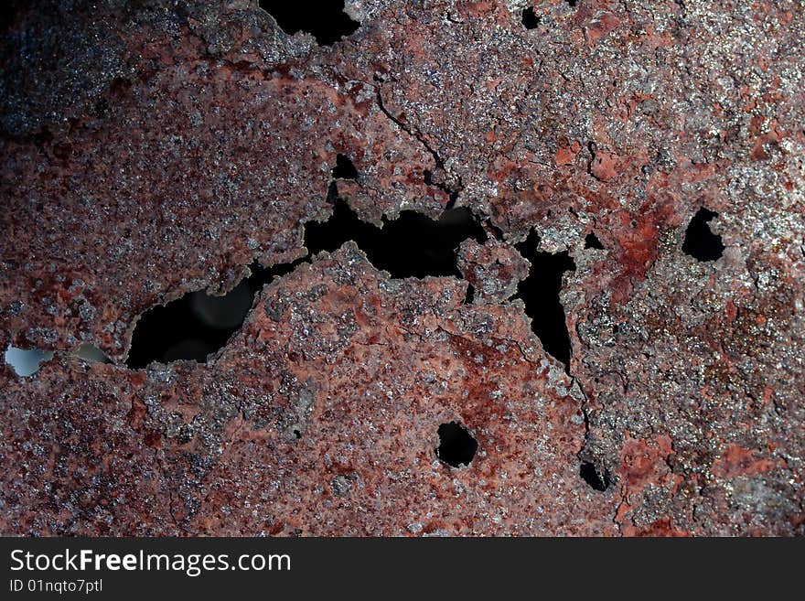 Rusty barrel texture under contrast sunlight reflex