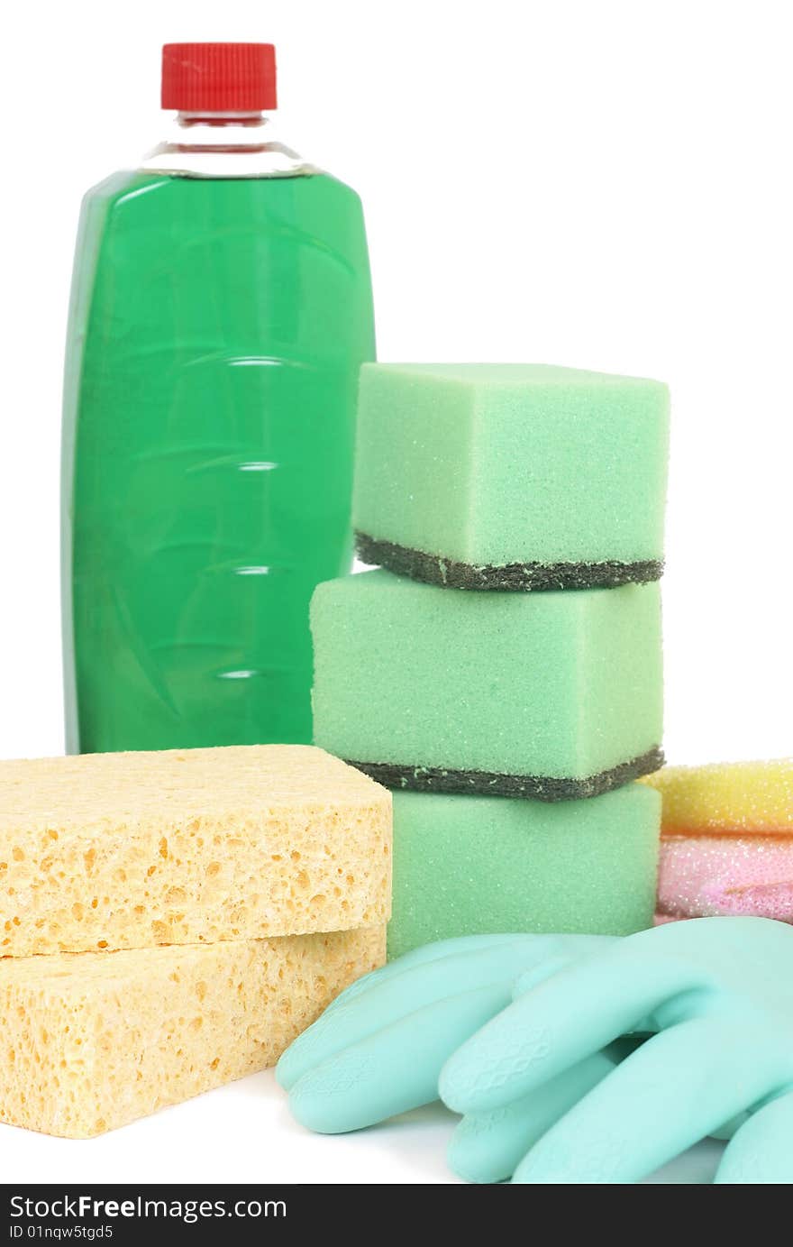 Variety of cleaning products - sponges, gloves, and bottle with chemicals isolated on white background