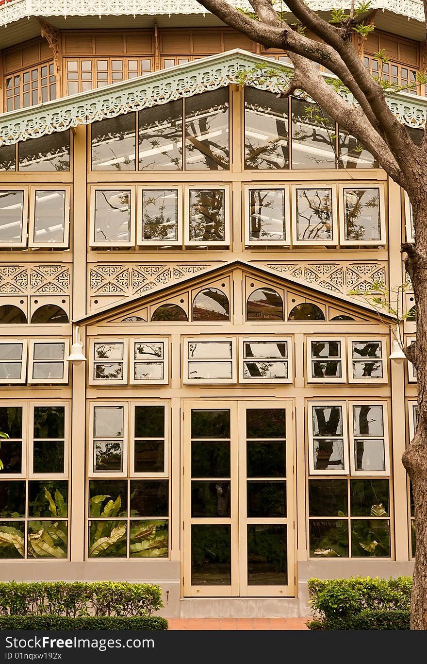 Glass house with wood carving