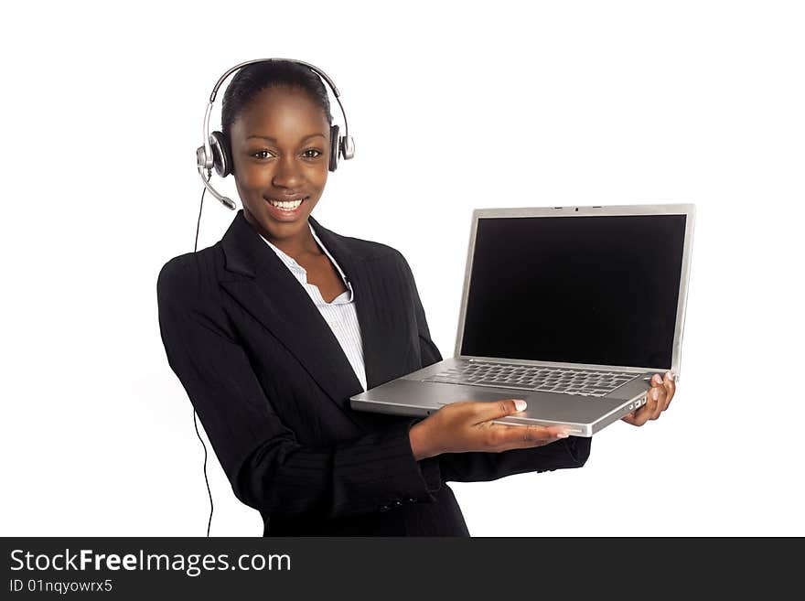 A coloured worker presenting on a laptop. A coloured worker presenting on a laptop