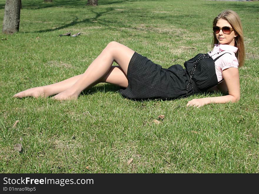 Girl lying on grass in a park