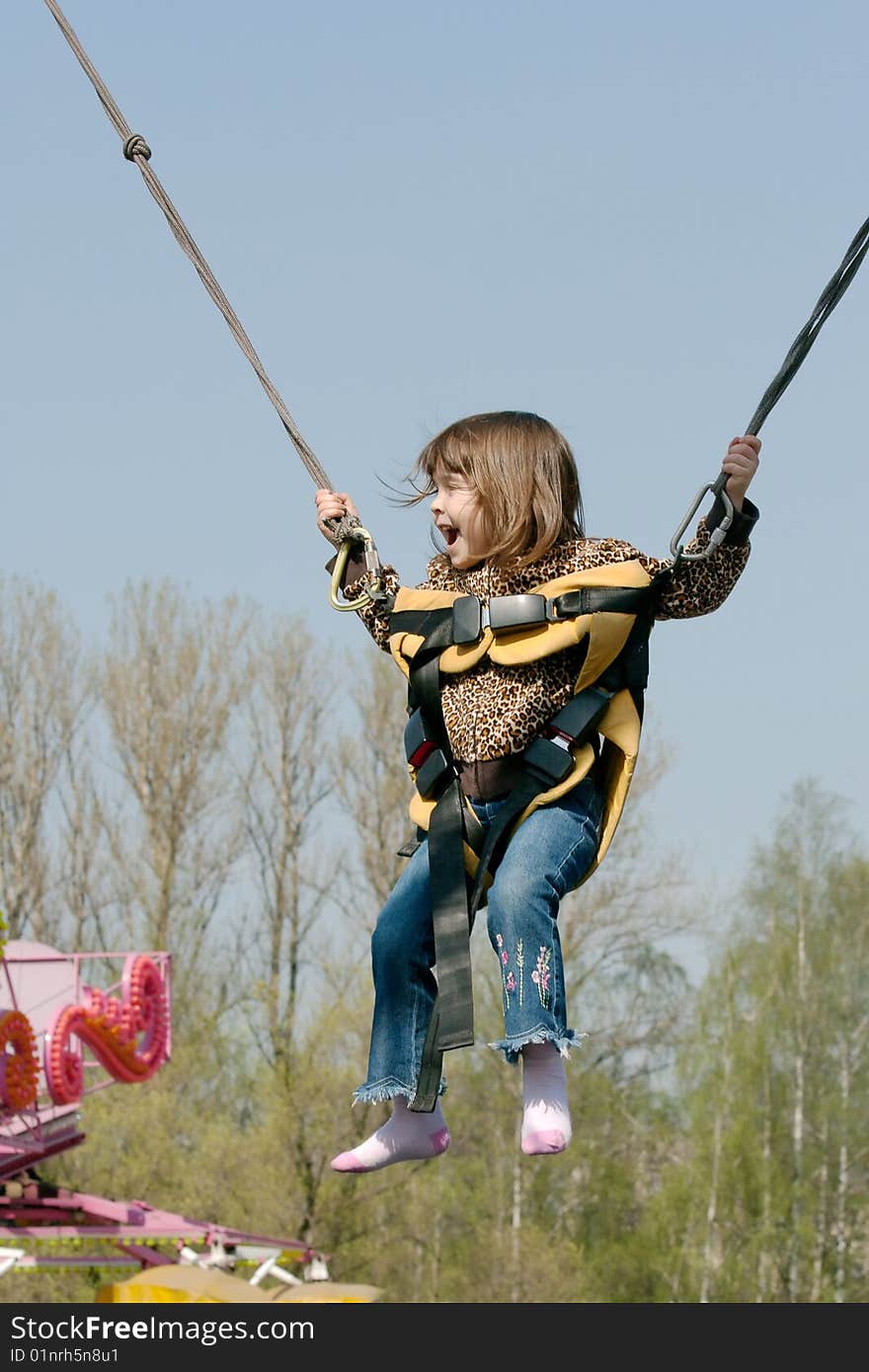 Little girl is jumping and laughing. Little girl is jumping and laughing