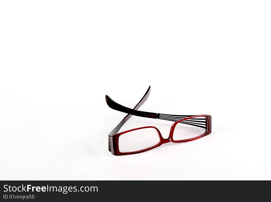 Isolated dioptric dark red glasses on white. Isolated dioptric dark red glasses on white