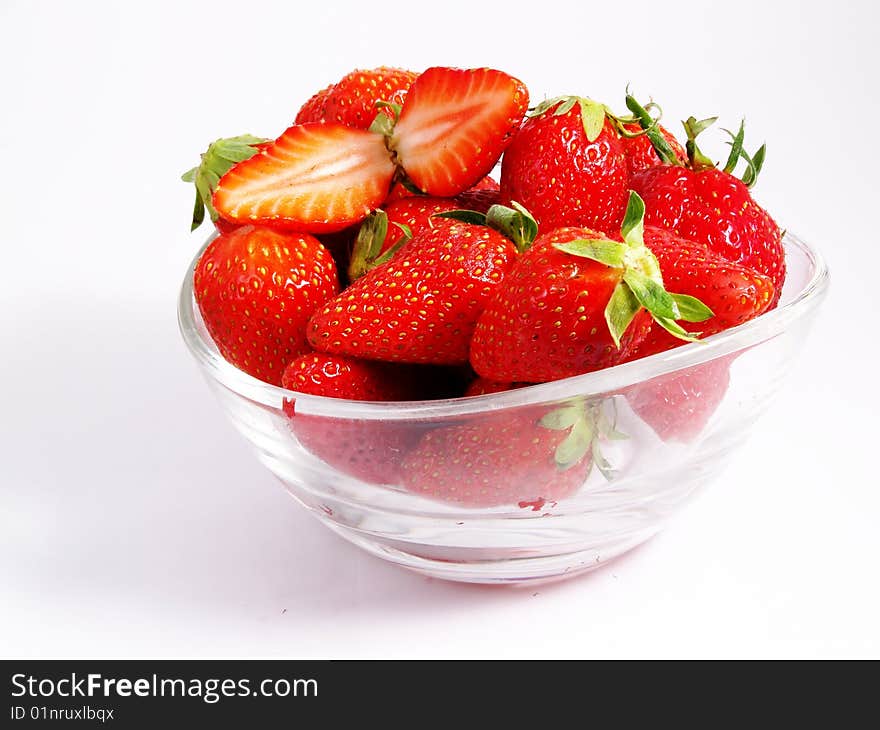 Bowl full of fresh strawberries on a white background. Bowl full of fresh strawberries on a white background