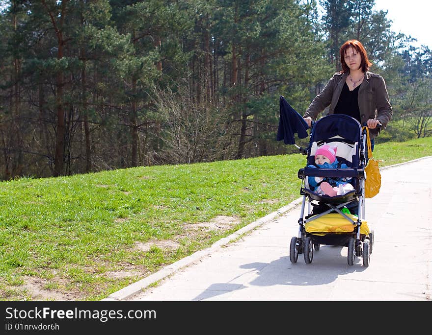 Woman and her baby outdoor. Woman and her baby outdoor