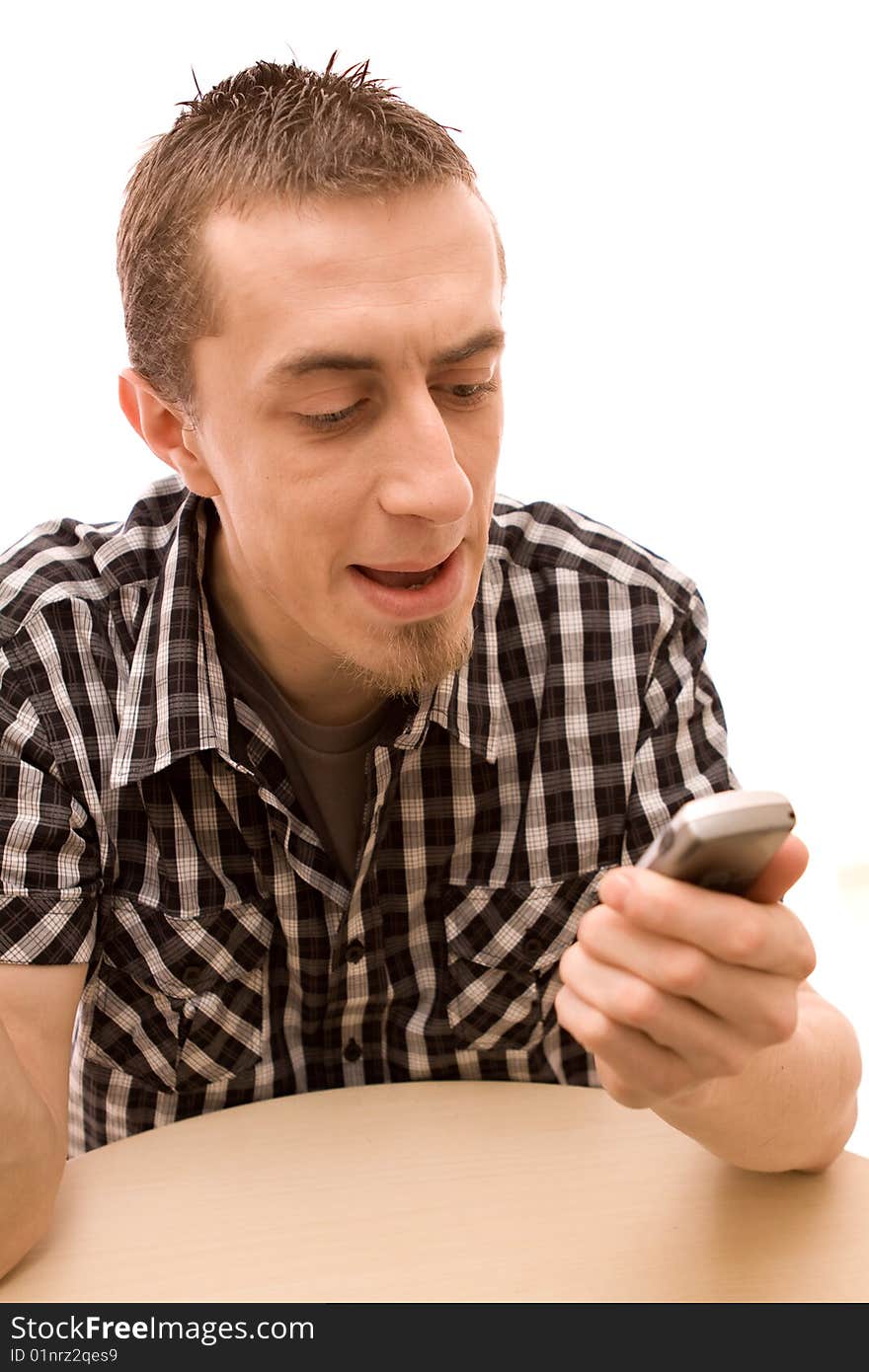 Man with phone working in office