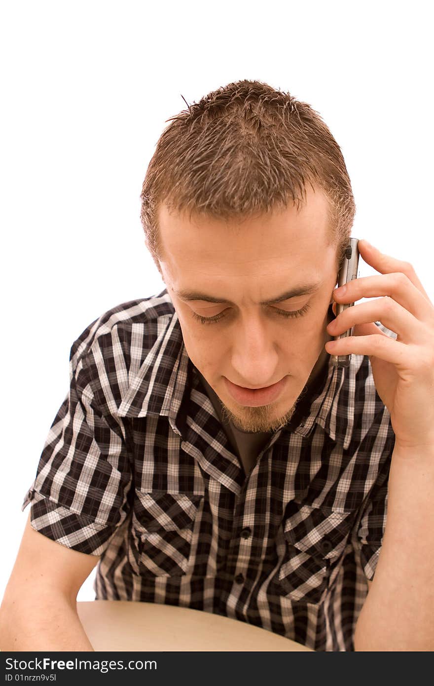 Man with phone working in office