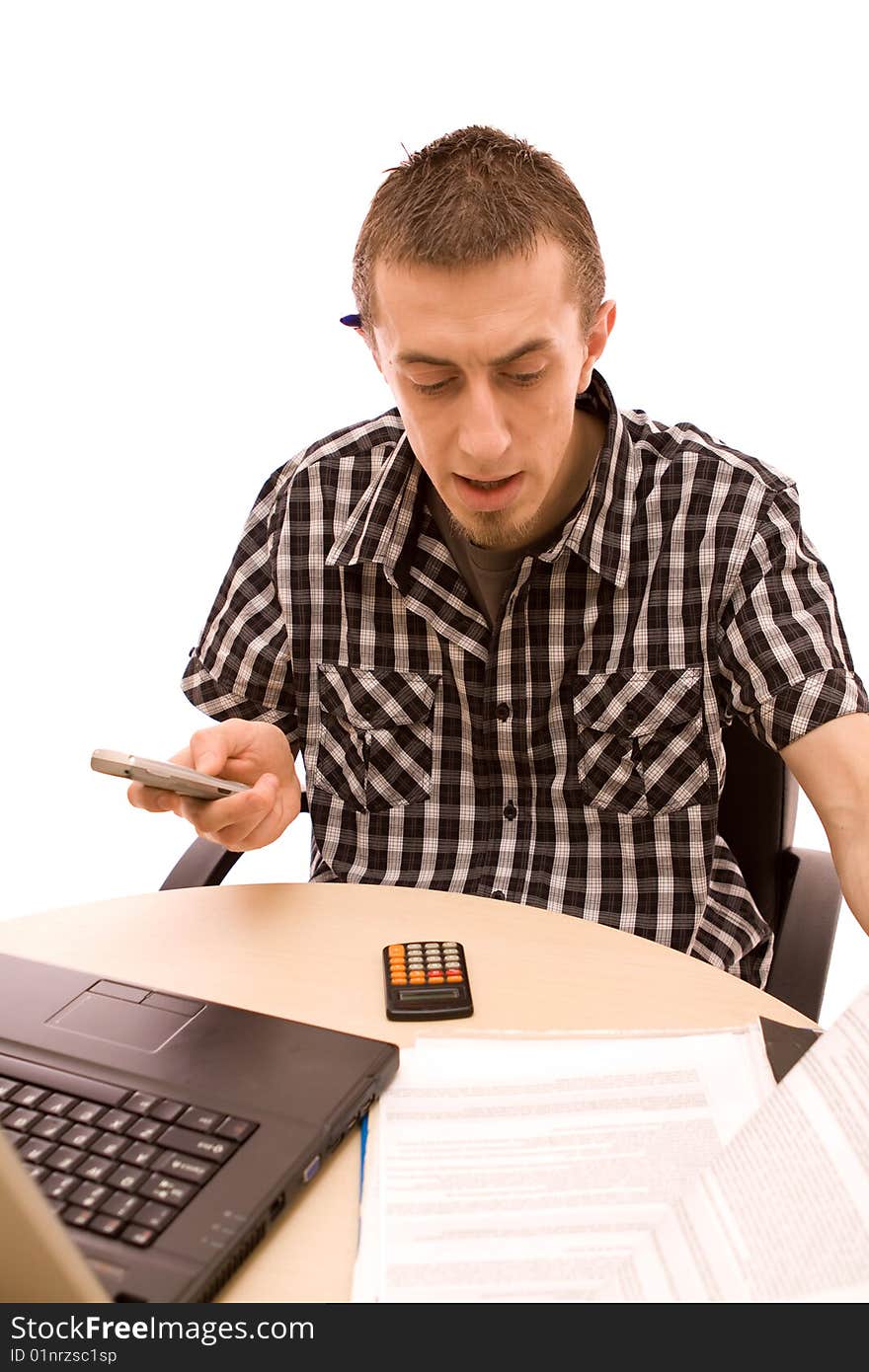 Man with phone working in office