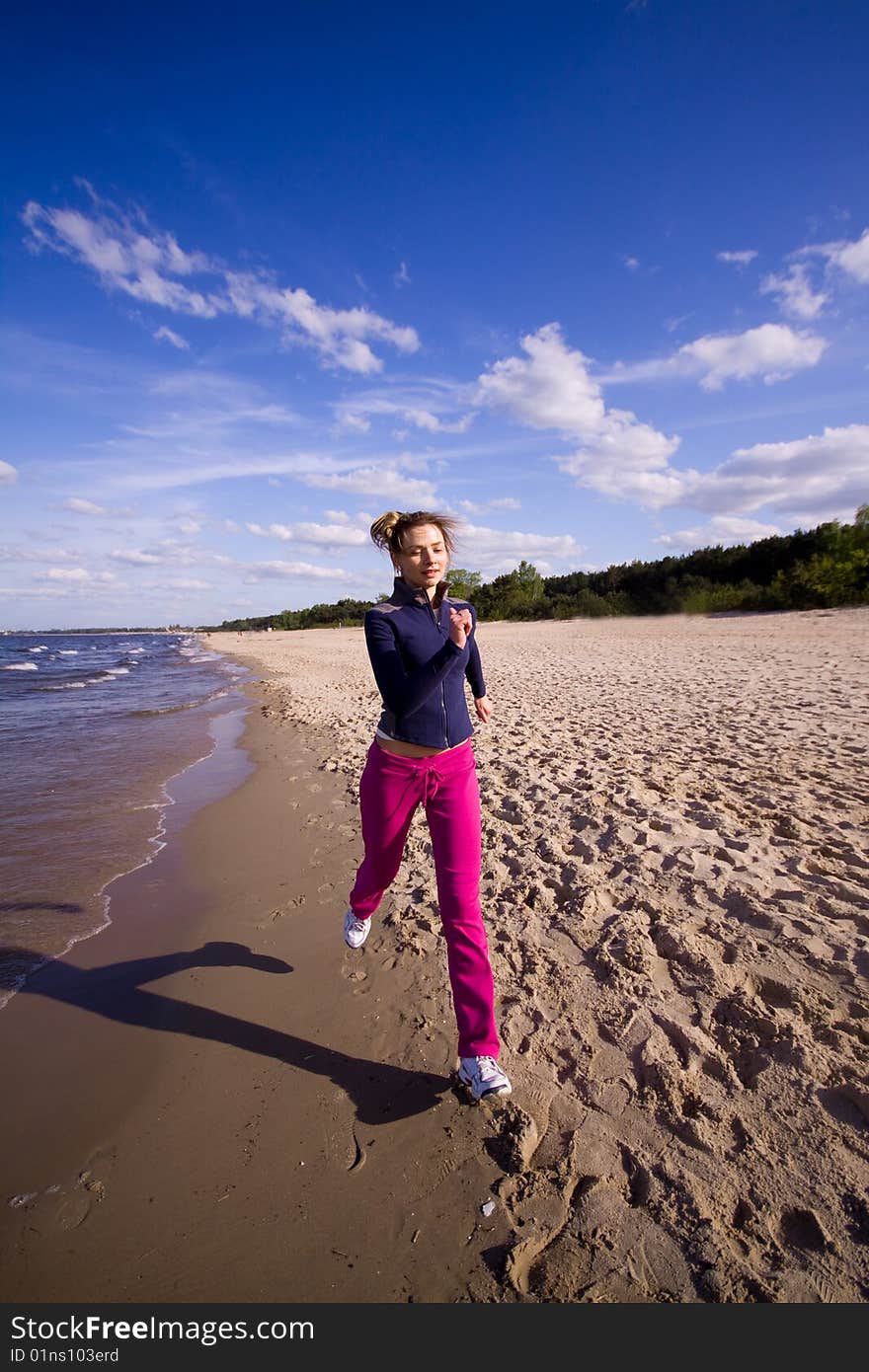 Active woman running on the beach. Active woman running on the beach