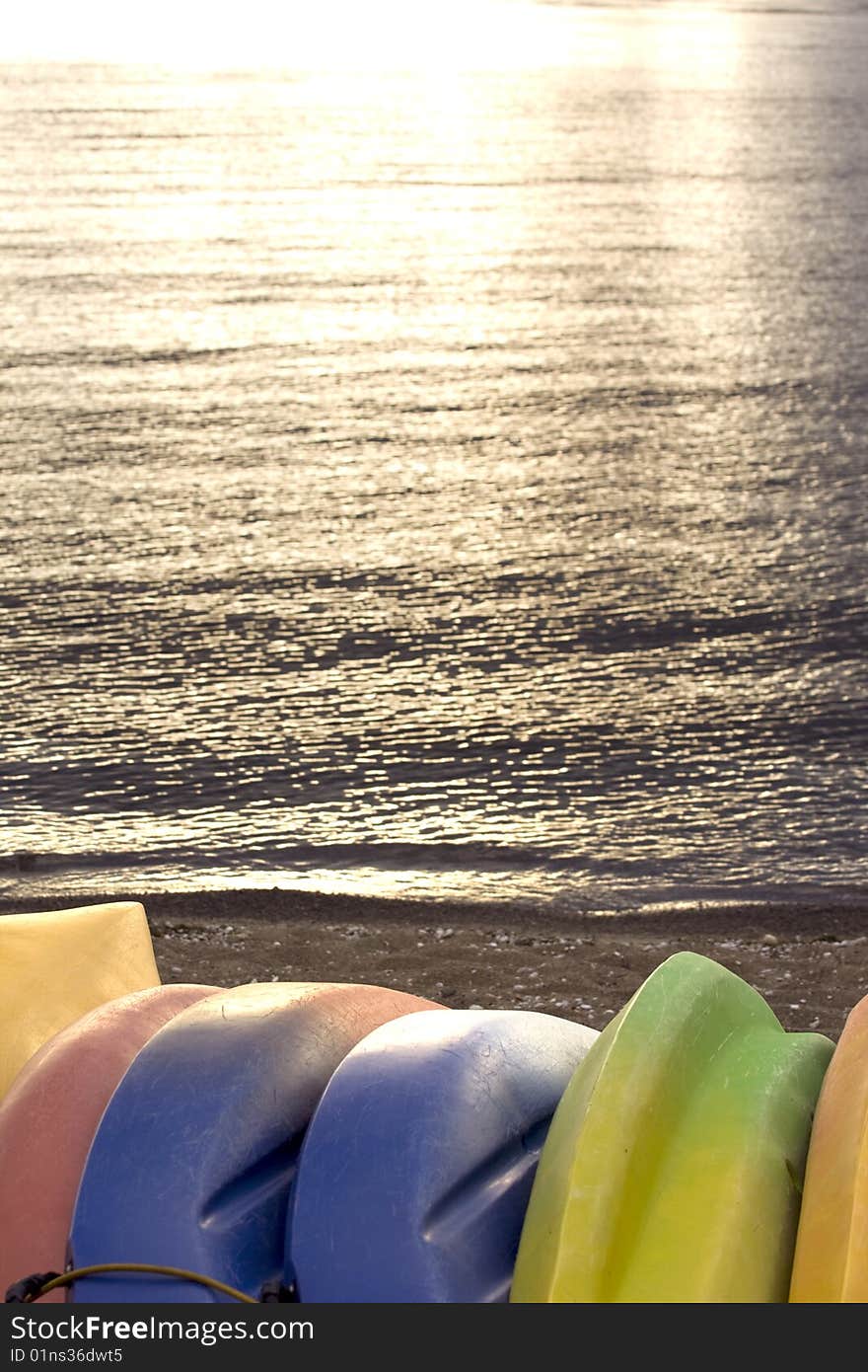 Colorful Kayaks by a Lake for Recreation