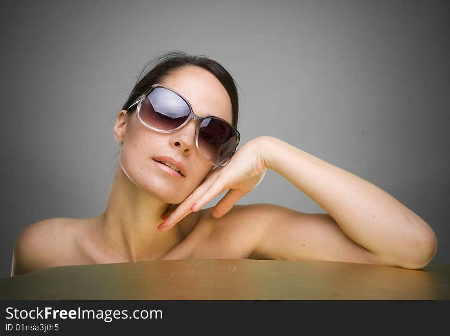 Portrait of beautiful young woman wearing sunglasses. Portrait of beautiful young woman wearing sunglasses