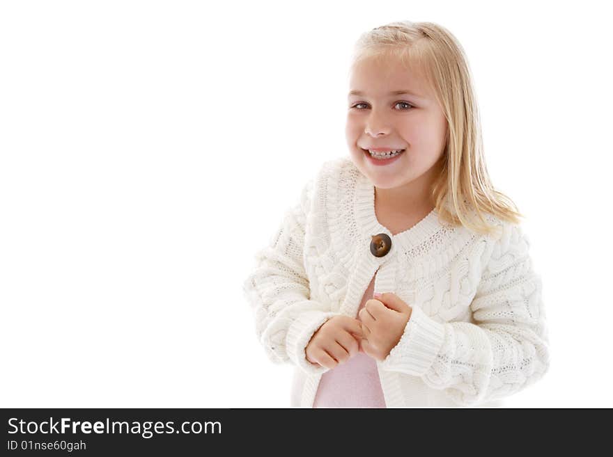 Cute little girl wearing a white sweater.