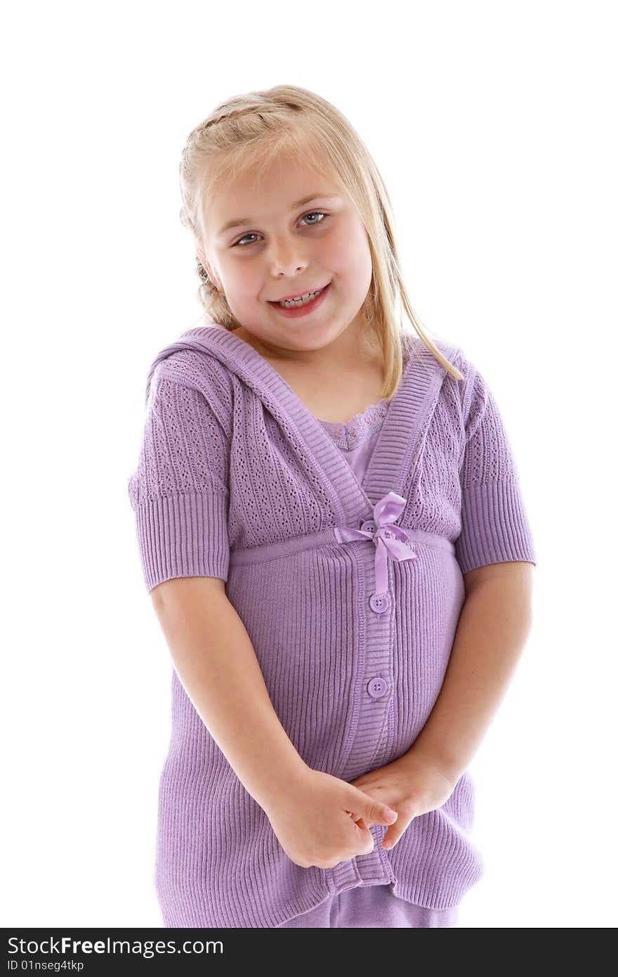 Cute little girl wearing a purple sweater.