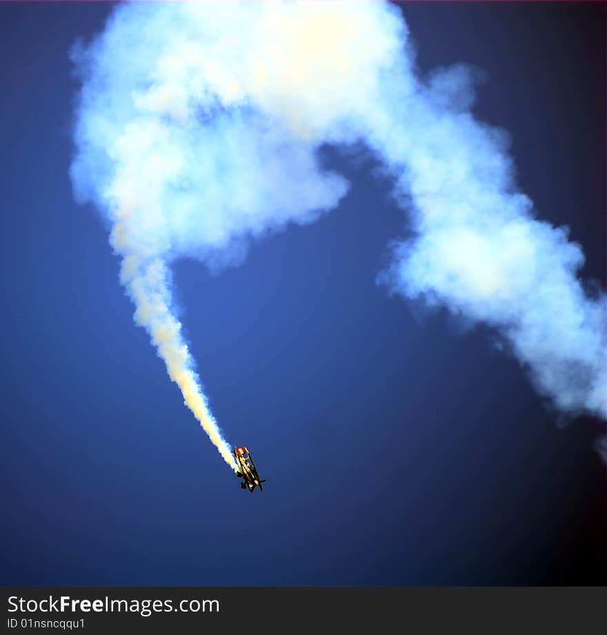 A stunt pilot plane during a flight show.