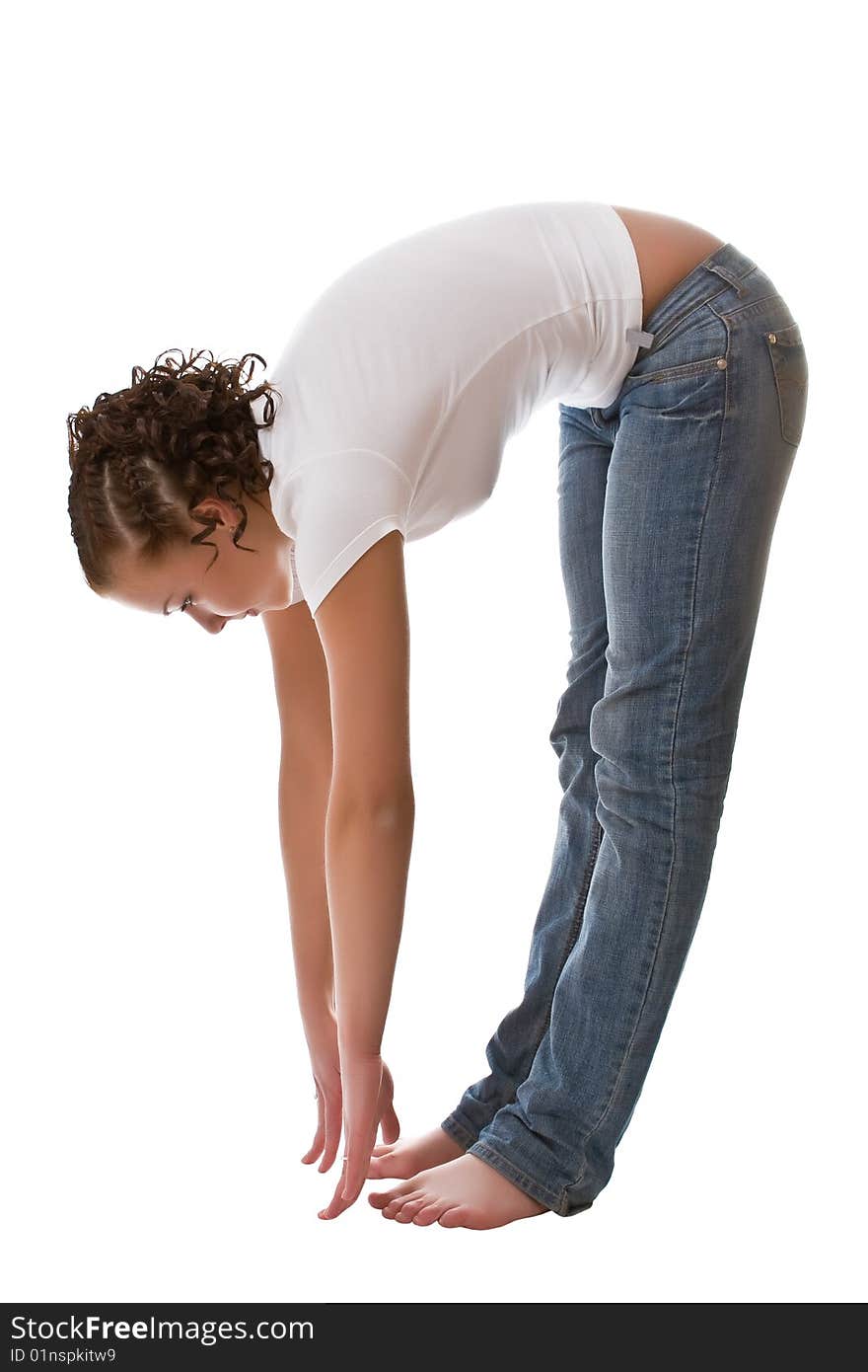 Girl in a white vest and jeans isolated on a white background. Girl in a white vest and jeans isolated on a white background