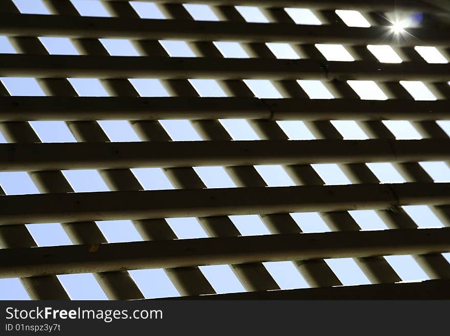 Nature, ray of sunlight captured through a fence