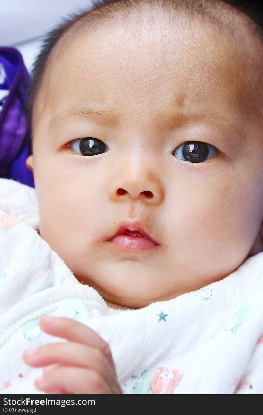 It is a cute chinese baby, isolated. he is 5 months. It is a cute chinese baby, isolated. he is 5 months