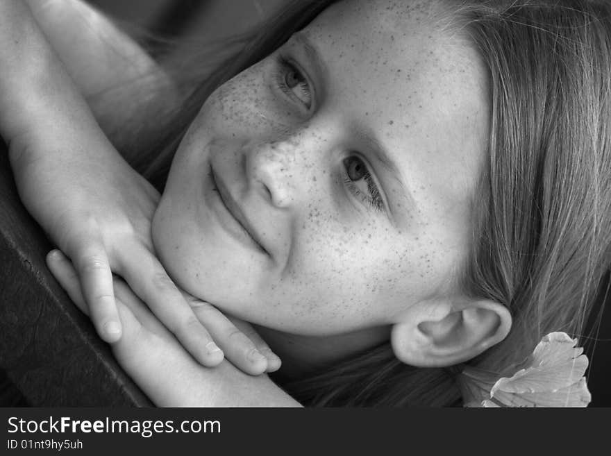 A white caucasian girl child relaxing. Picture in black and white. A white caucasian girl child relaxing. Picture in black and white