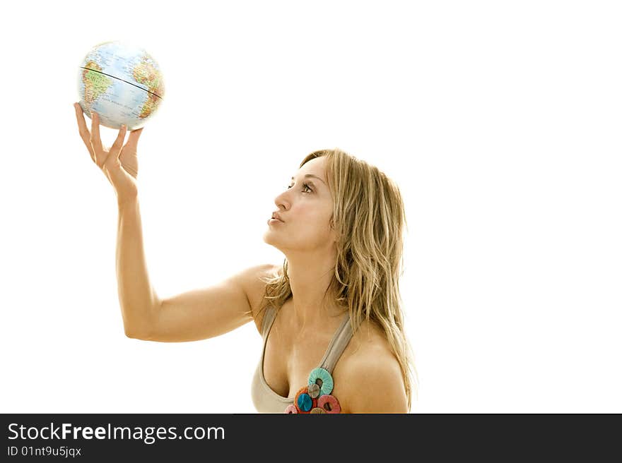 Young woman holding a small globe in her hand. Young woman holding a small globe in her hand.