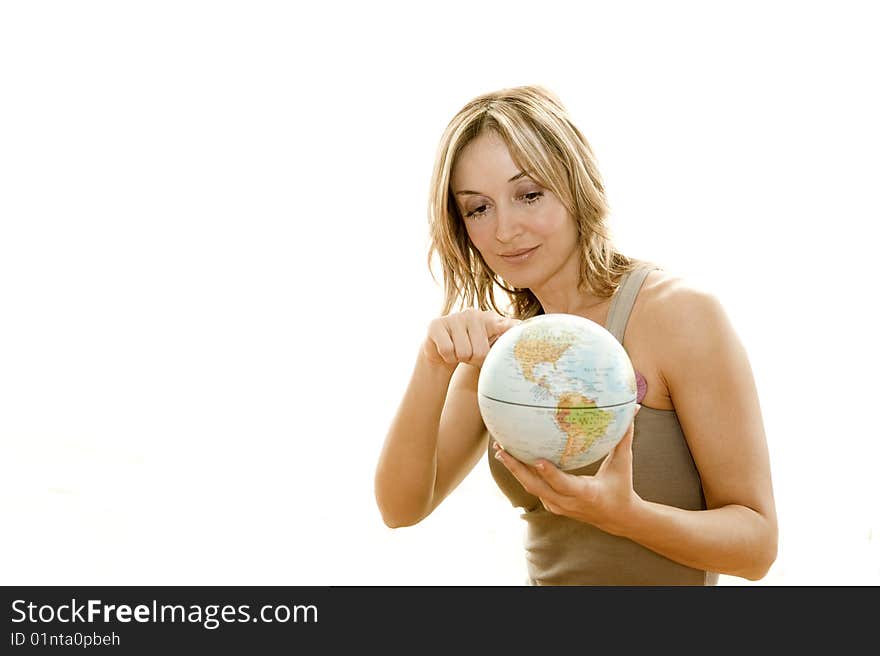 Young woman holding a small globe in her hand. Young woman holding a small globe in her hand.