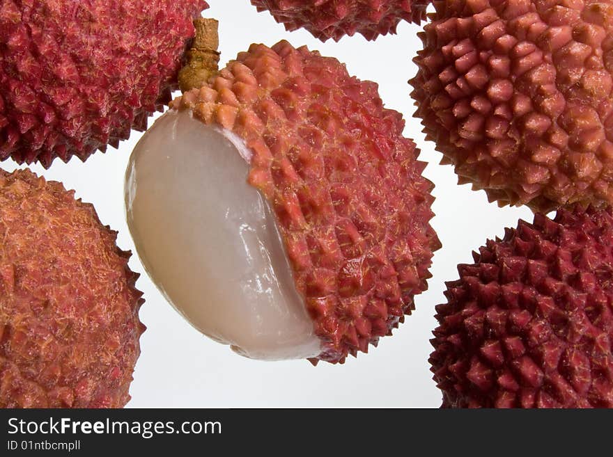 A selection of lychees against a white background. A selection of lychees against a white background