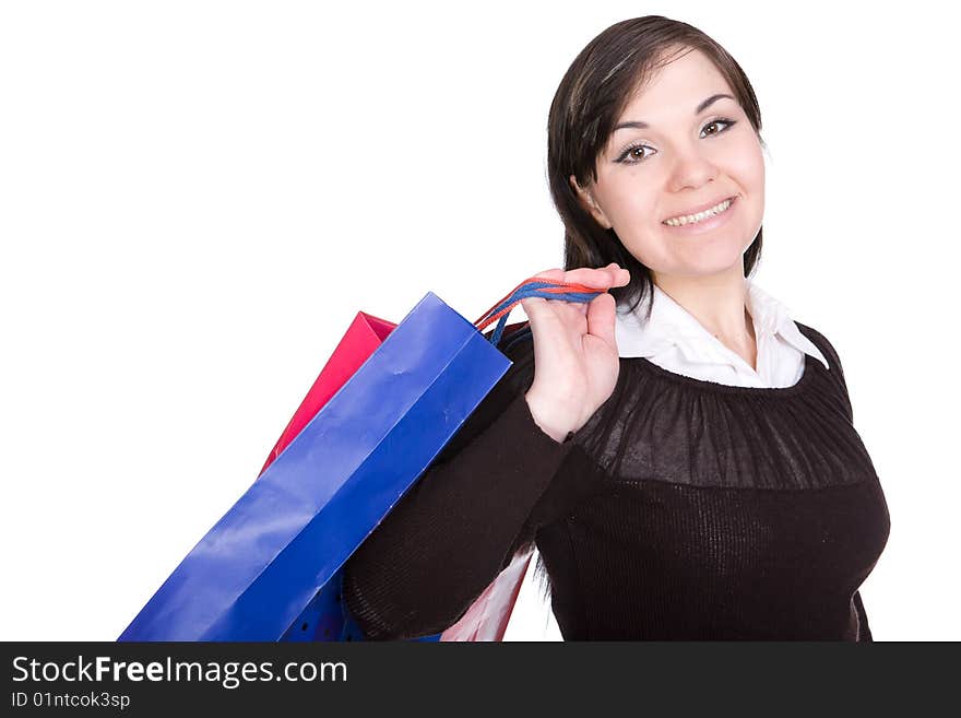 Attractive brunette woman with shopping bags. over white background