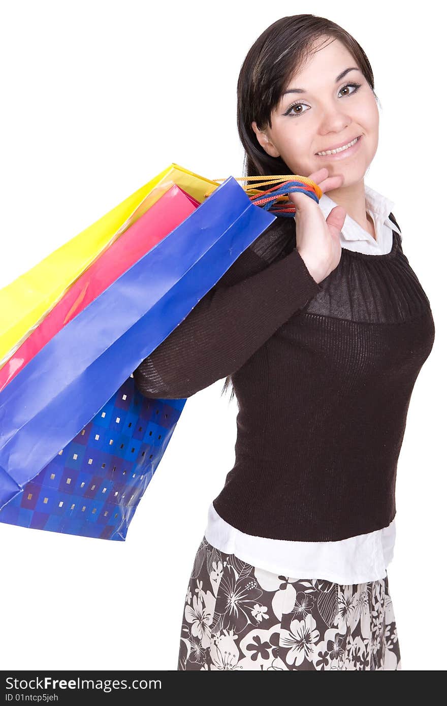 Attractive brunette woman with shopping bags. over white background