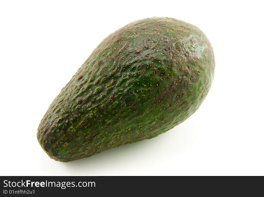 Single whole dark green avocado fruit on a white background. Single whole dark green avocado fruit on a white background