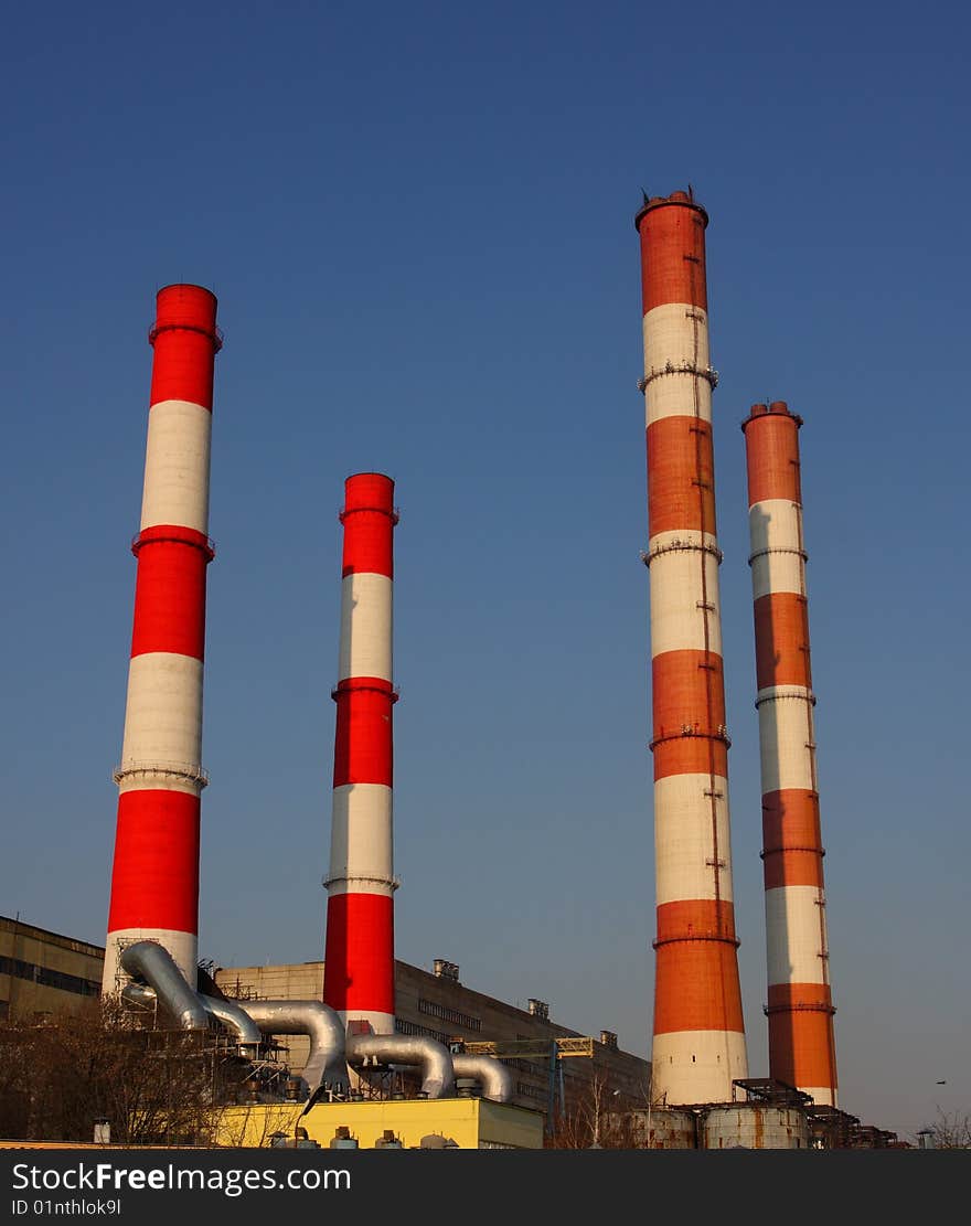 4 plant pipes at the blue sky background. 4 plant pipes at the blue sky background.