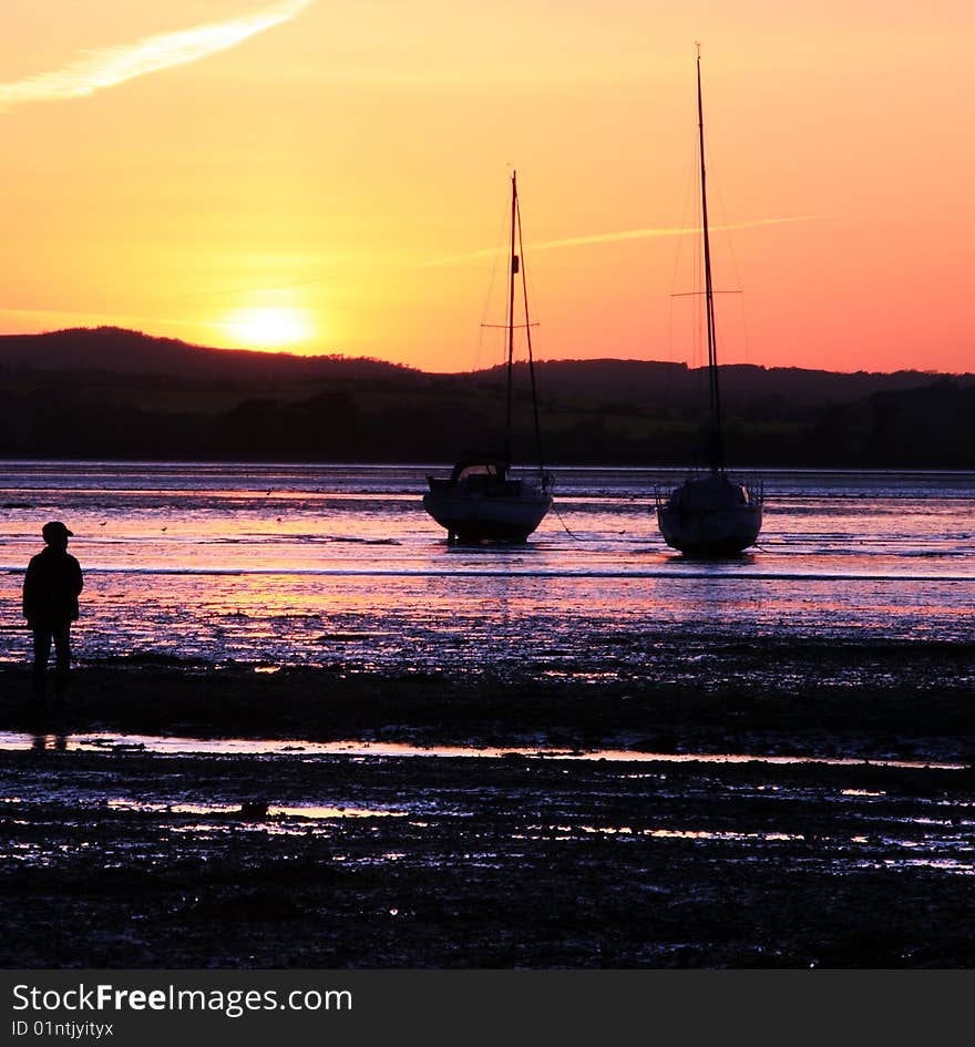 Sunset in Devon silhouetting the boats. Sunset in Devon silhouetting the boats